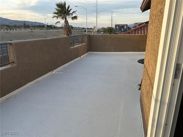 view of patio featuring a balcony