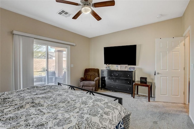 carpeted bedroom featuring ceiling fan, visible vents, and access to exterior