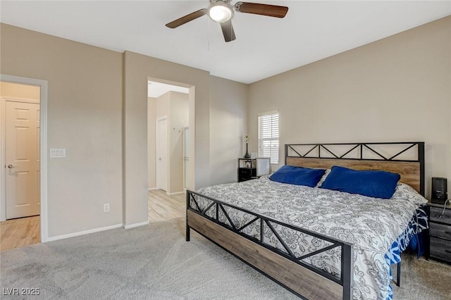 carpeted bedroom featuring ceiling fan and baseboards