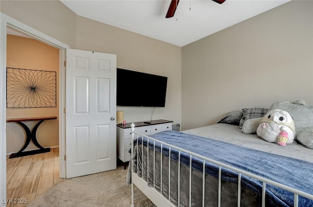 bedroom with light carpet and ceiling fan