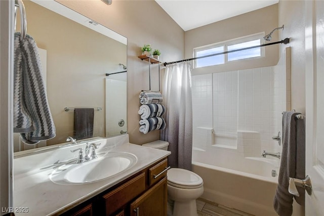 full bathroom featuring vanity, shower / tub combo, and toilet