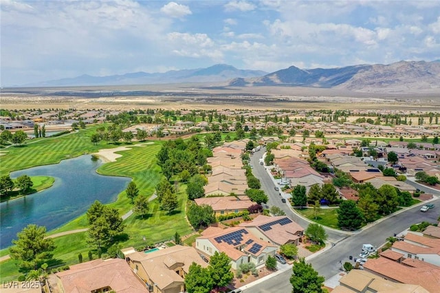 bird's eye view featuring golf course view, a residential view, and a water and mountain view