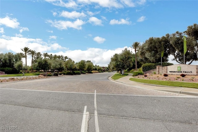 view of road with curbs and sidewalks