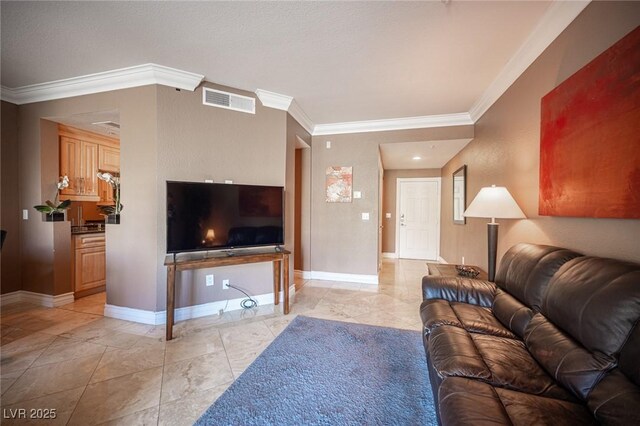 living area featuring visible vents, crown molding, and baseboards