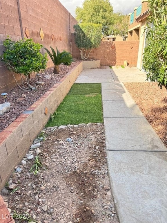 view of yard with a fenced backyard