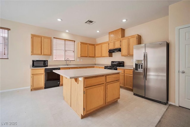 7317 Caballo Range Ave, Las Vegas, NV 89179 - kitchen featuring black appliances, a sink, light brown cabinetry, a kitchen island, and recessed lighting