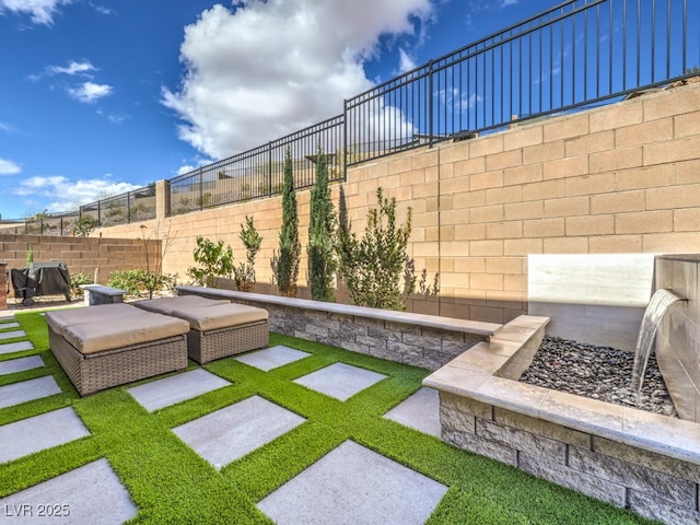 view of yard with a patio area, an outdoor hangout area, and a fenced backyard