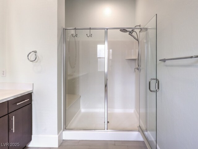 full bathroom with vanity and a shower stall