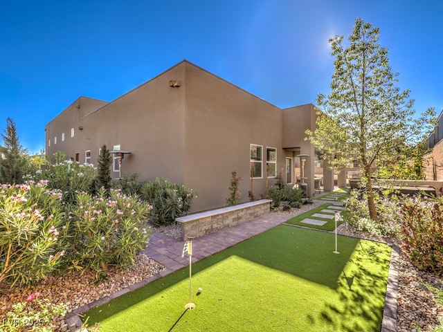 exterior space featuring stucco siding