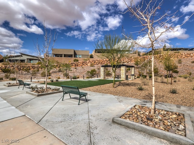 view of property's community with a patio