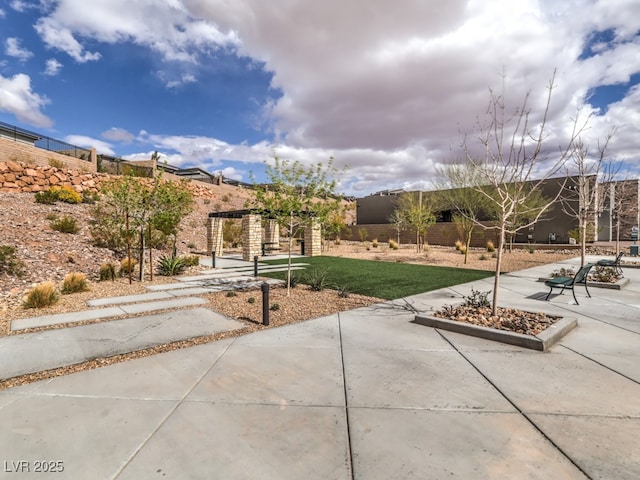 exterior space featuring a patio area and fence