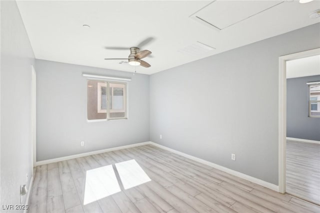 unfurnished room featuring wood finished floors, baseboards, and ceiling fan