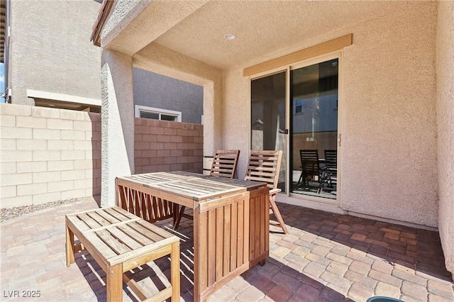 view of patio / terrace with outdoor dining space and fence