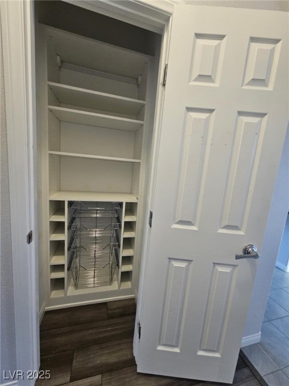 details featuring baseboards and wood finished floors