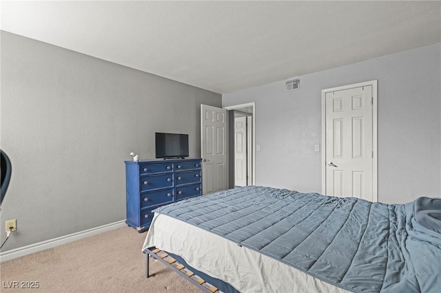 bedroom featuring baseboards, visible vents, and light carpet