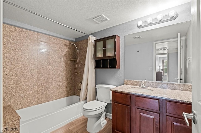 full bath with visible vents, shower / bath combo with shower curtain, toilet, a textured ceiling, and wood finished floors