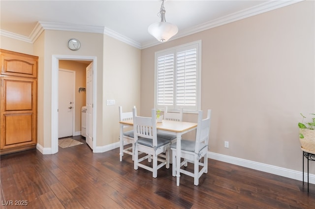 dining space featuring dark wood finished floors, baseboards, and ornamental molding