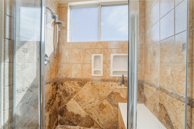 full bath featuring a shower stall