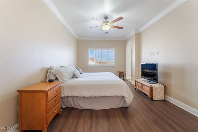 bedroom featuring dark wood finished floors, ceiling fan, crown molding, and baseboards