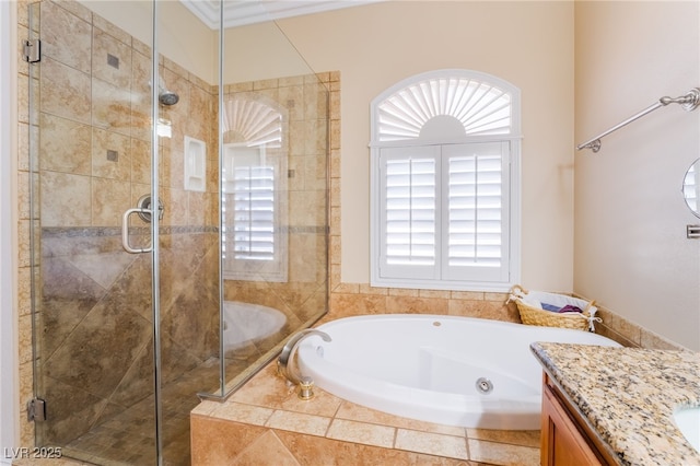 bathroom with a stall shower, a jetted tub, vanity, and crown molding