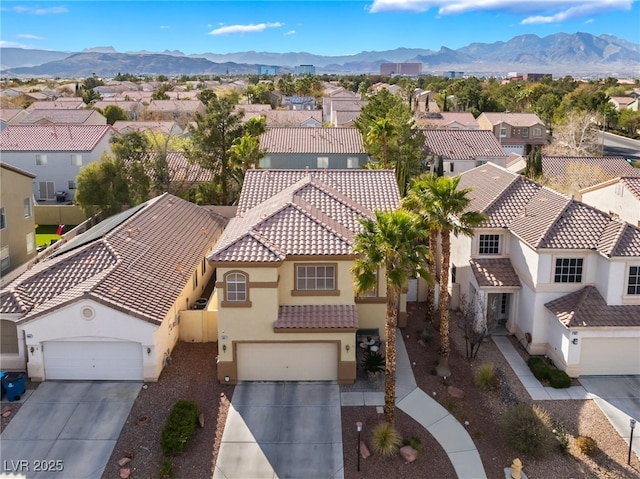 drone / aerial view with a mountain view and a residential view