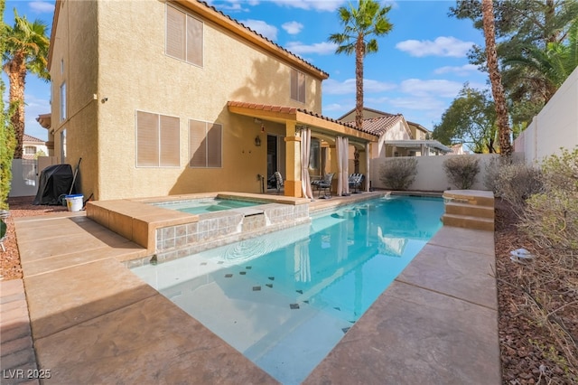 view of pool featuring a fenced in pool, a patio, an in ground hot tub, and a fenced backyard