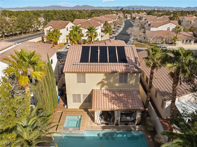 birds eye view of property with a mountain view and a residential view