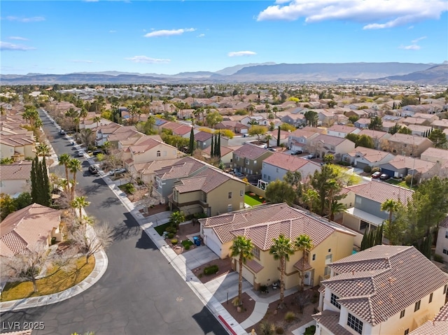 birds eye view of property with a residential view and a mountain view