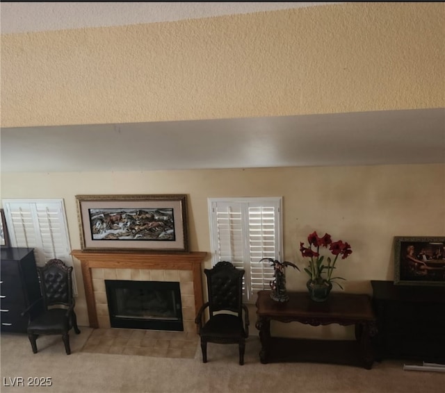 carpeted living room with a fireplace
