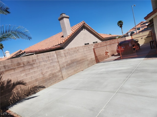view of patio / terrace with a gate and fence
