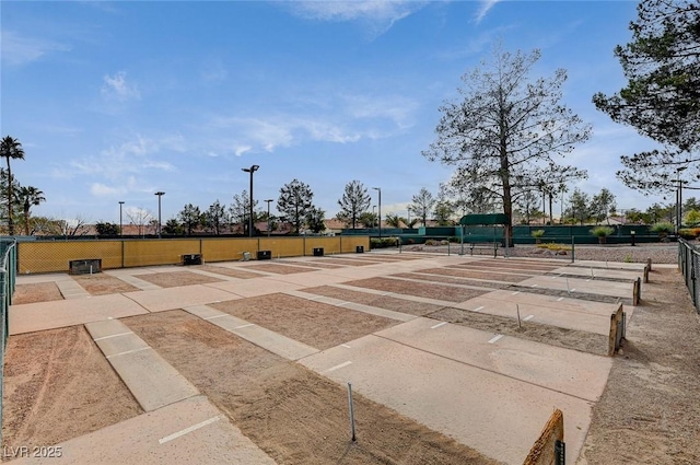 view of property's community with fence