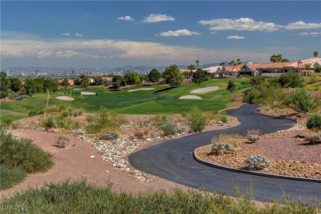 view of home's community featuring view of golf course