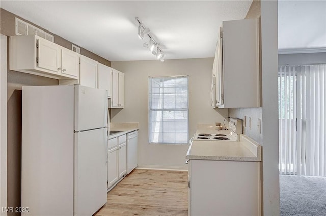 231 W Horizon Ridge Parkway Unit 426, Henderson, NV 89012 - kitchen with white appliances, light wood-style flooring, light countertops, white cabinets, and rail lighting