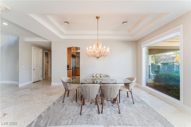 2221 Glenbrook Way, Las Vegas, NV 89117 - dining room featuring a chandelier, visible vents, arched walkways, and a raised ceiling