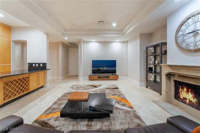 2221 Glenbrook Way, Las Vegas, NV 89117 - living area with a raised ceiling, recessed lighting, visible vents, and a high end fireplace