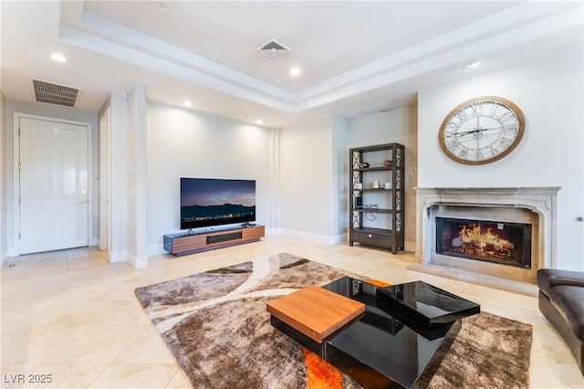 2221 Glenbrook Way, Las Vegas, NV 89117 - living area with a raised ceiling, recessed lighting, visible vents, and a high end fireplace