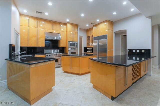 2221 Glenbrook Way, Las Vegas, NV 89117 - kitchen featuring visible vents, built in appliances, dark countertops, and exhaust hood