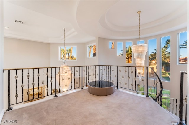2221 Glenbrook Way, Las Vegas, NV 89117 - corridor featuring visible vents, carpet, a raised ceiling, and an inviting chandelier