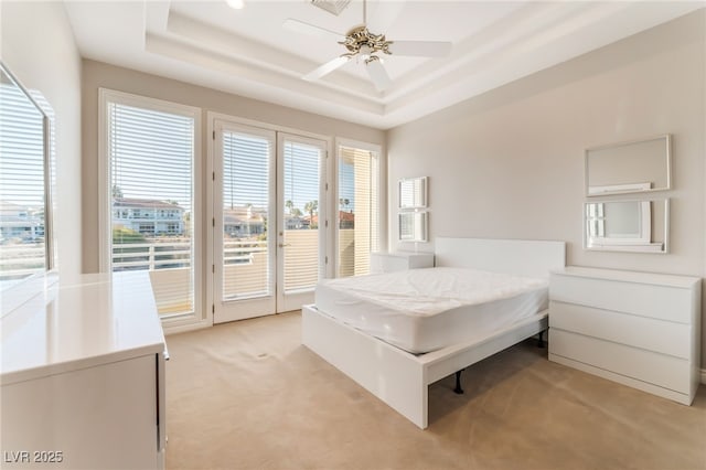 2221 Glenbrook Way, Las Vegas, NV 89117 - bedroom featuring ceiling fan, a raised ceiling, light colored carpet, and access to exterior