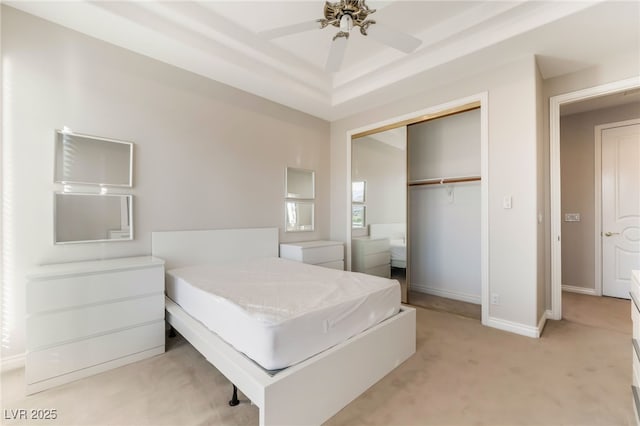 2221 Glenbrook Way, Las Vegas, NV 89117 - bedroom featuring a ceiling fan, baseboards, a closet, light carpet, and a raised ceiling