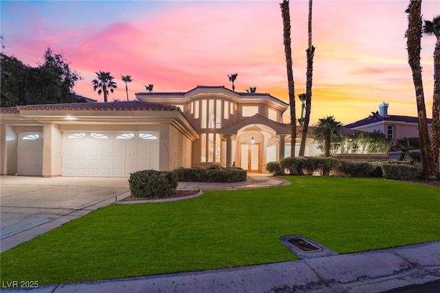 2221 Glenbrook Way, Las Vegas, NV 89117 - view of front of property featuring a front lawn, a tiled roof, stucco siding, driveway, and an attached garage
