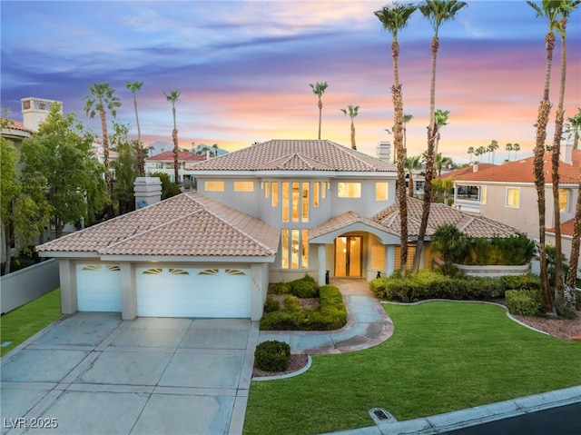 2221 Glenbrook Way, Las Vegas, NV 89117 - mediterranean / spanish home with stucco siding, a front yard, an attached garage, and a tiled roof