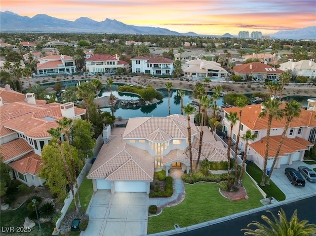 2221 Glenbrook Way, Las Vegas, NV 89117 - aerial view at dusk featuring a residential view and a water and mountain view