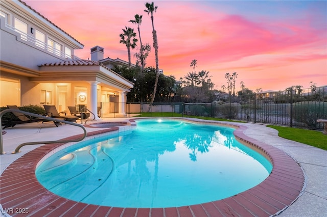 2221 Glenbrook Way, Las Vegas, NV 89117 - pool at dusk featuring a fenced in pool, a patio, and fence