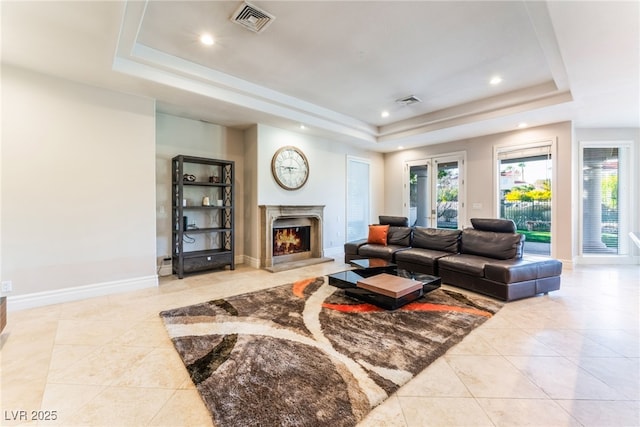 2221 Glenbrook Way, Las Vegas, NV 89117 - living area featuring a tray ceiling and light tile patterned flooring