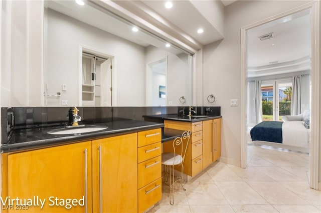 2221 Glenbrook Way, Las Vegas, NV 89117 - full bathroom featuring a sink, visible vents, double vanity, and tile patterned floors