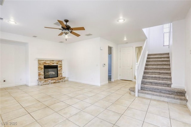 unfurnished living room with stairway, a ceiling fan, visible vents, light tile patterned flooring, and recessed lighting