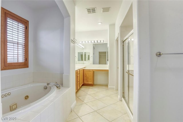 full bath featuring visible vents, a whirlpool tub, a stall shower, and vanity