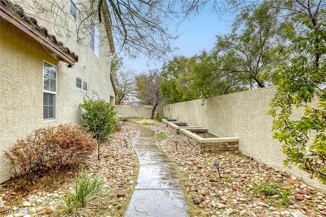 view of yard featuring a fenced backyard