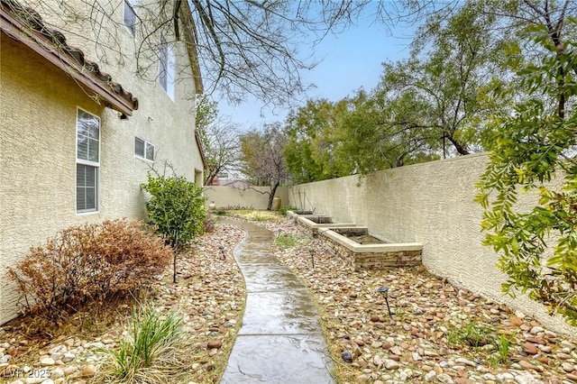 view of yard with a fenced backyard